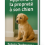 Chiot assis calmement sur un plancher, image de couverture de l’eBook “Apprendre la propreté à son chien” par Sylvain Duchesneau, éducateur canin à Terrebonne.